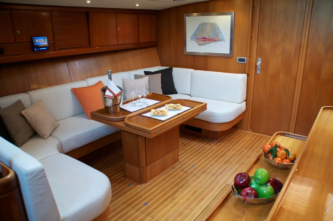 a living room with a couch and a table aboard VOLADOR Yacht for Sale