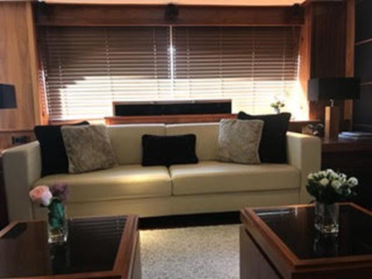 a living room with a couch and coffee table aboard 81935-3588701 Yacht for Sale