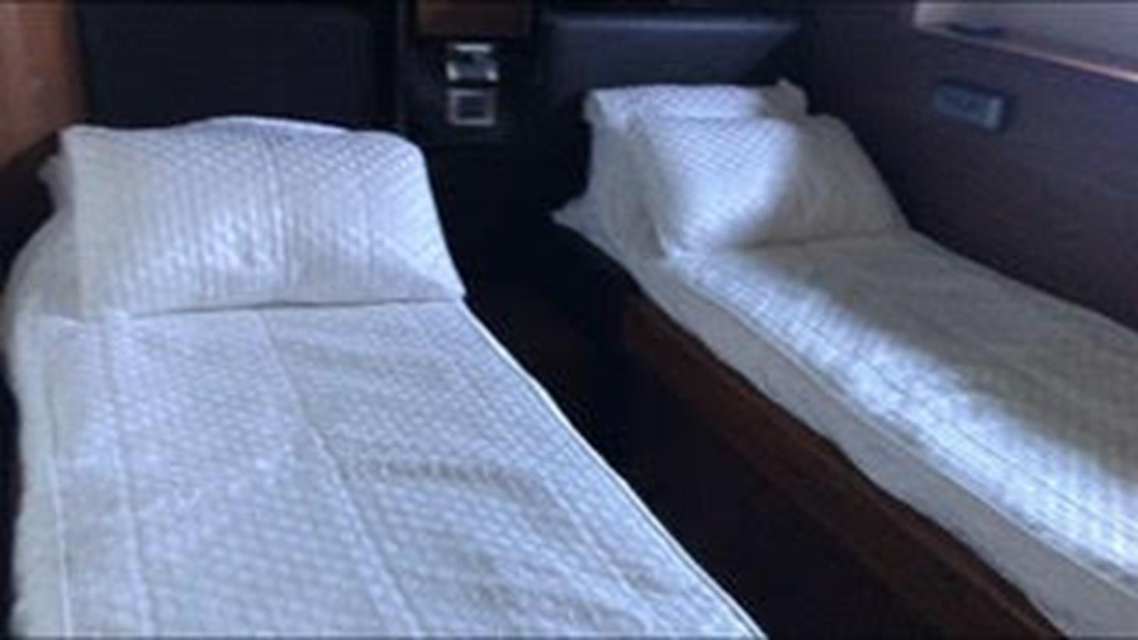 a bed with white sheets aboard 81935-3588701 Yacht for Sale