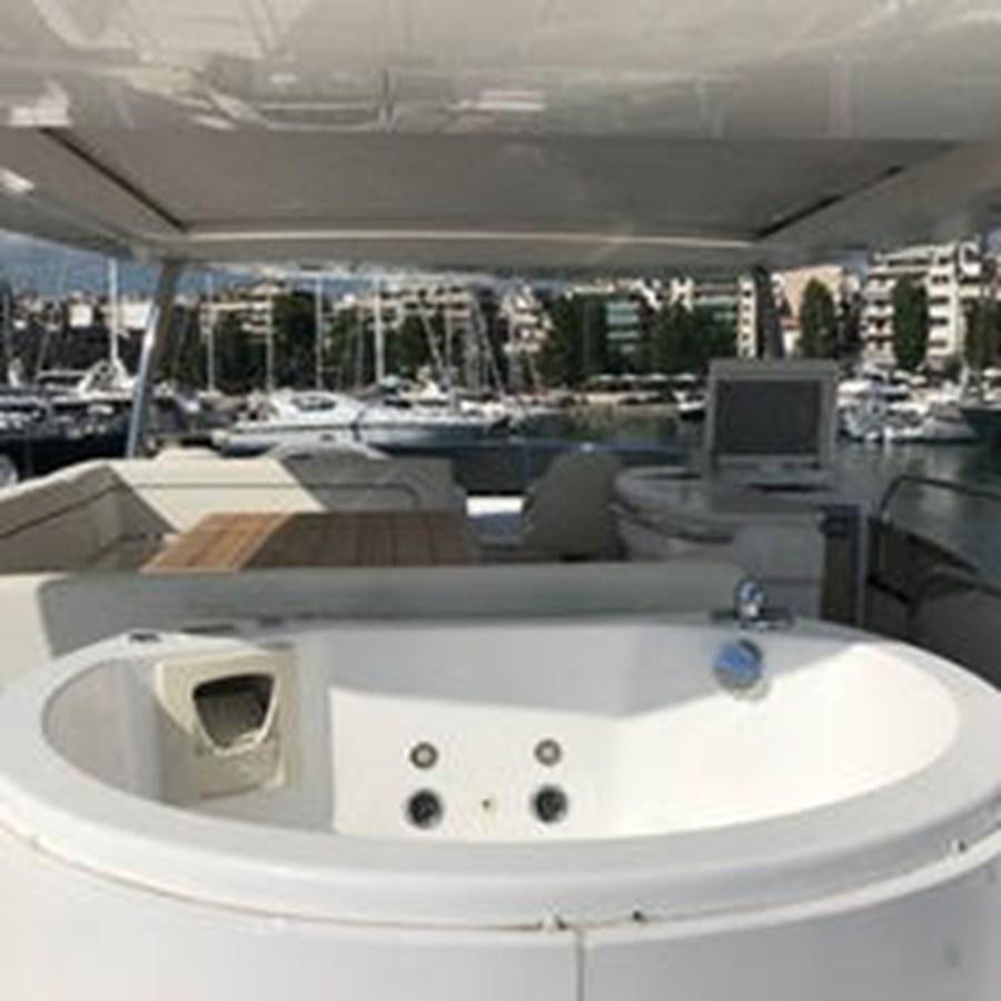 a large white table with a computer on it aboard 81935-3588701 Yacht for Sale