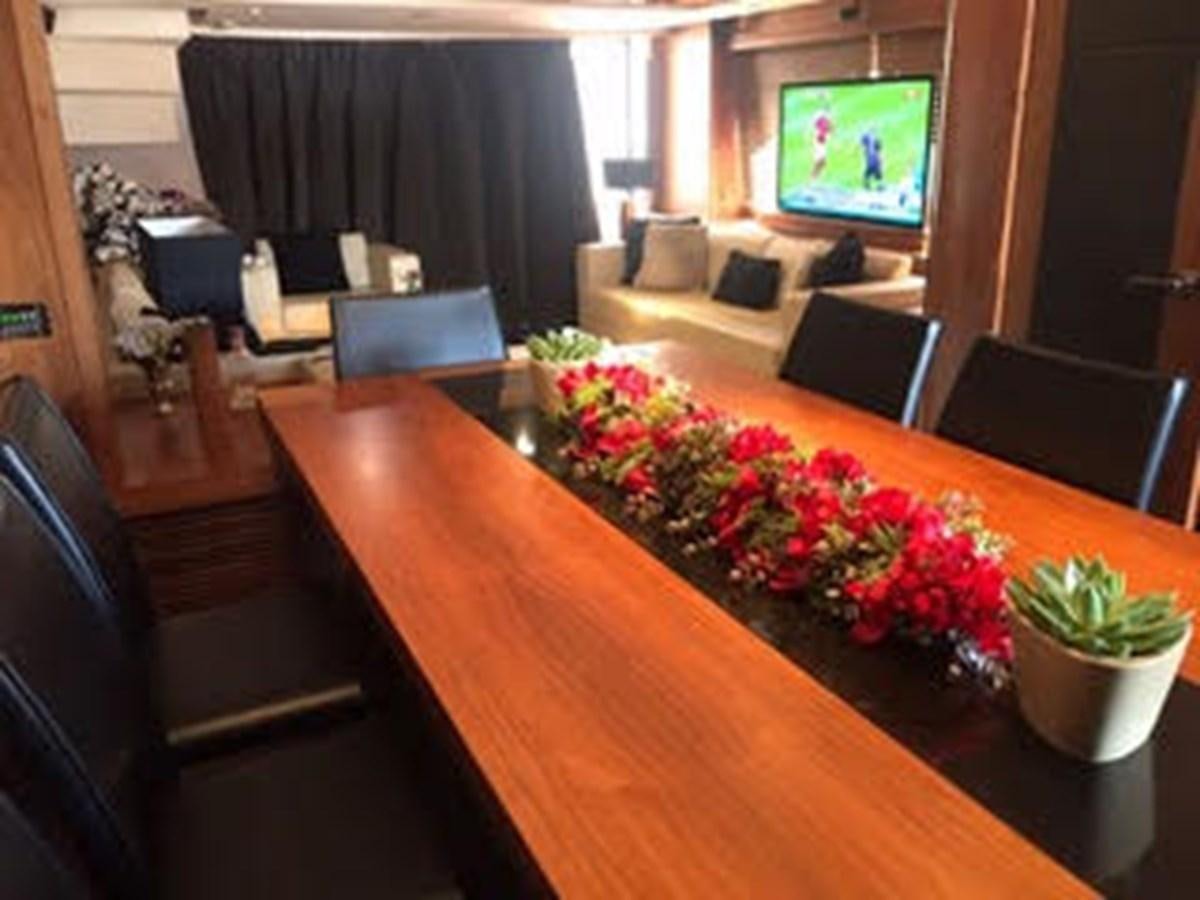 a living room with a table and couches aboard 81935-3588701 Yacht for Sale