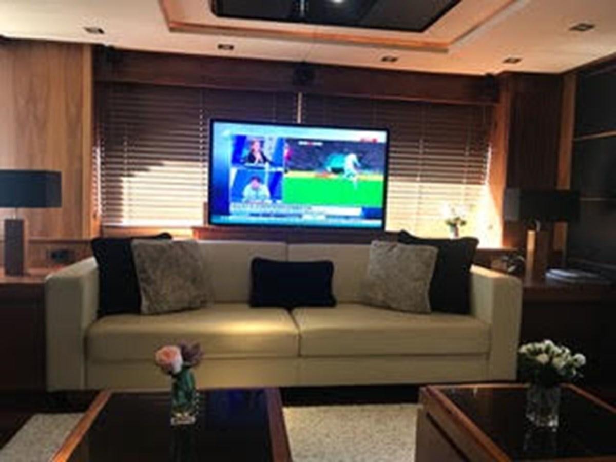 a living room with a large screen aboard 81935-3588701 Yacht for Sale