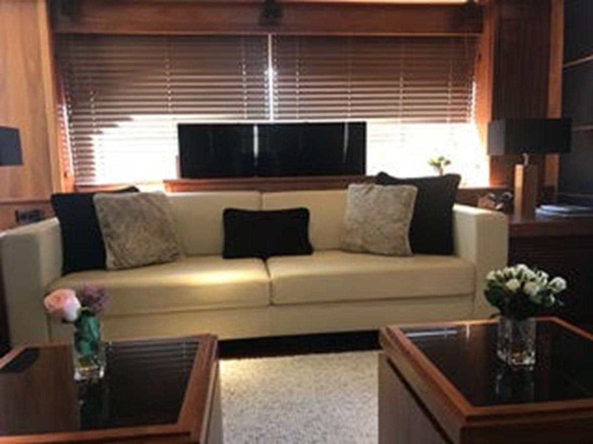 a living room with a couch and a television aboard 81935-3588701 Yacht for Sale