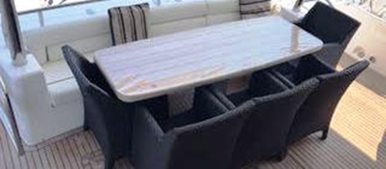 a table with chairs aboard 81935-3588701 Yacht for Sale