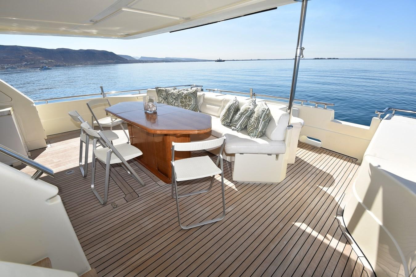 a table and chairs on a boat aboard SANTA MARIA III Yacht for Sale
