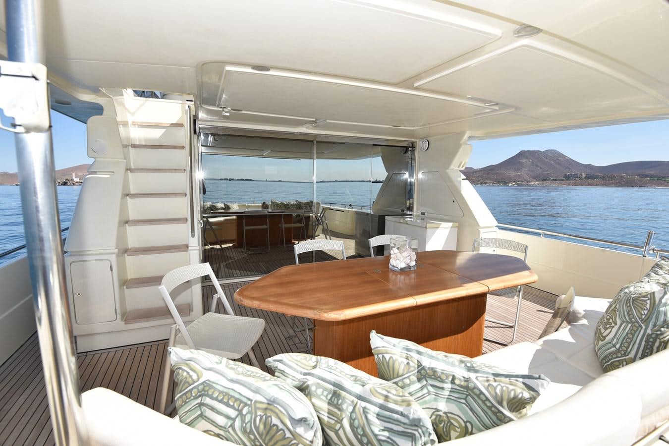 a boat with a table and chairs aboard SANTA MARIA III Yacht for Sale