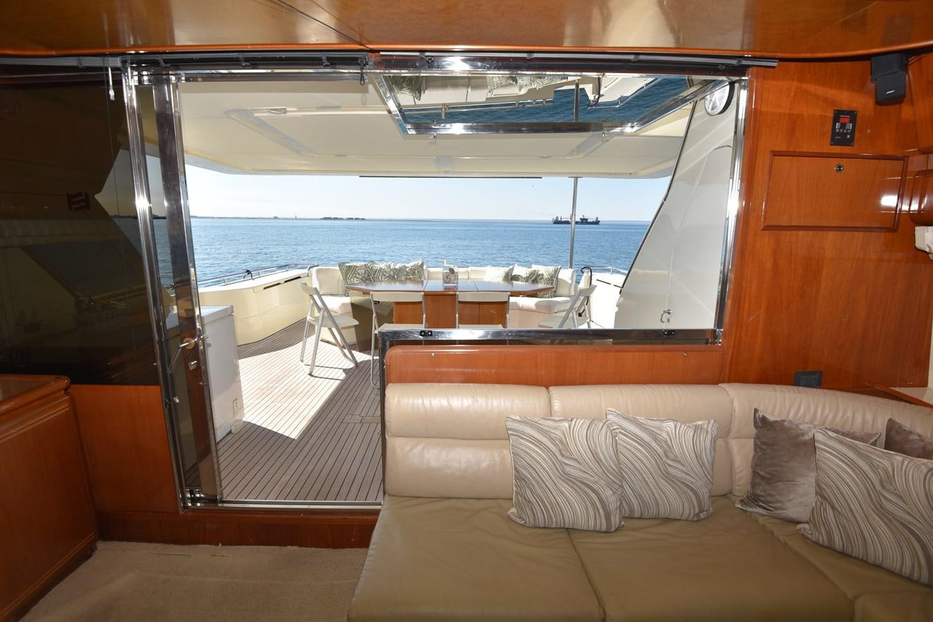 a room with a couch and a table and chairs aboard SANTA MARIA III Yacht for Sale