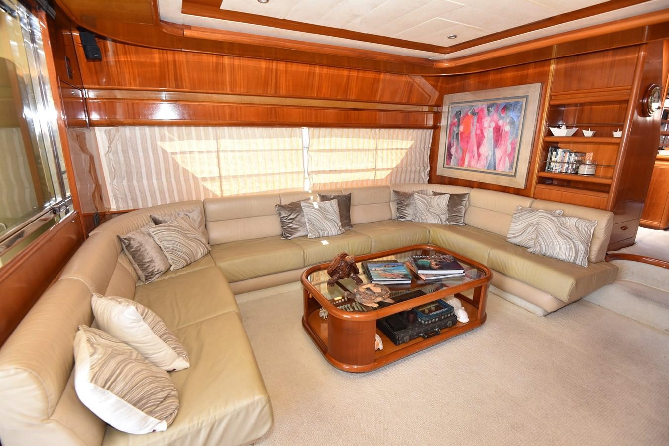 a living room with a couch and a coffee table aboard SANTA MARIA III Yacht for Sale