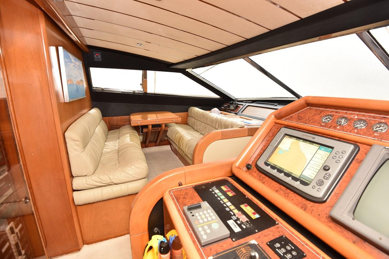 a laptop on a table aboard SANTA MARIA III Yacht for Sale