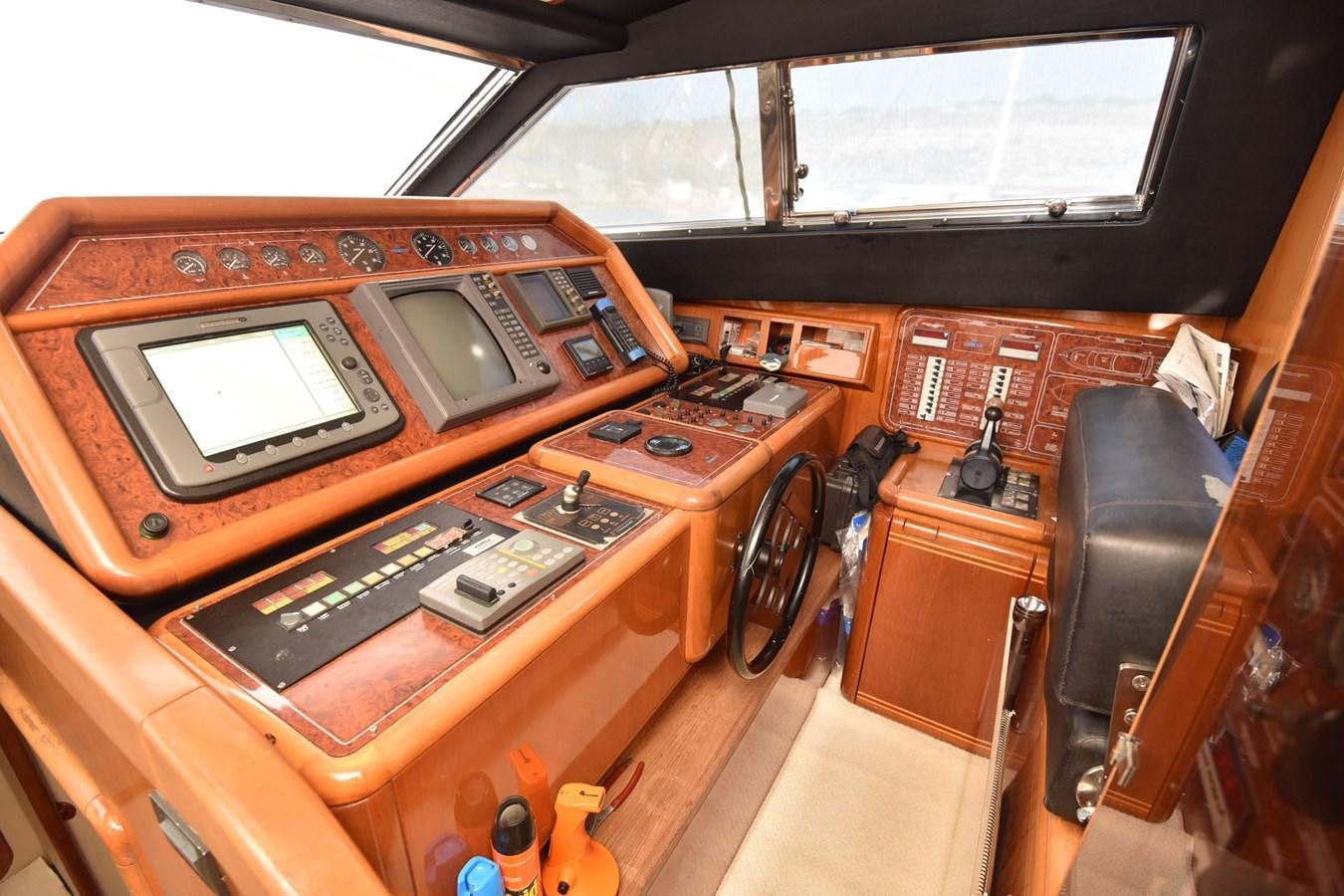 a wooden desk with a laptop and other office supplies aboard SANTA MARIA III Yacht for Sale