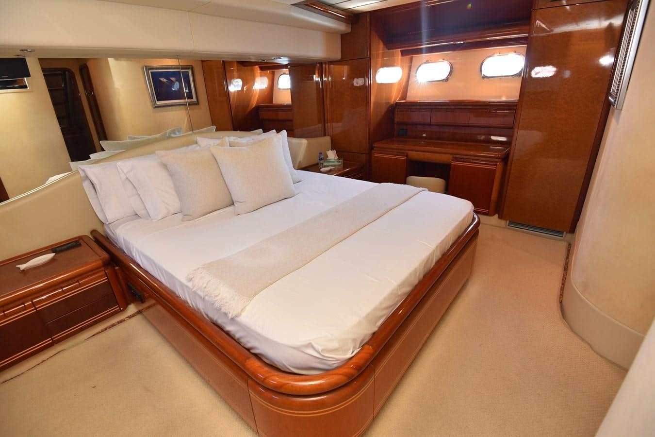 a bed in a room aboard SANTA MARIA III Yacht for Sale