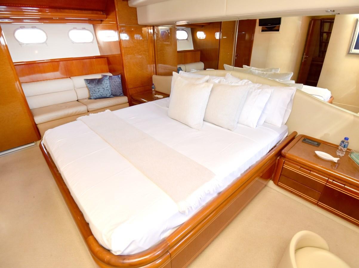 a bed with white sheets aboard SANTA MARIA III Yacht for Sale