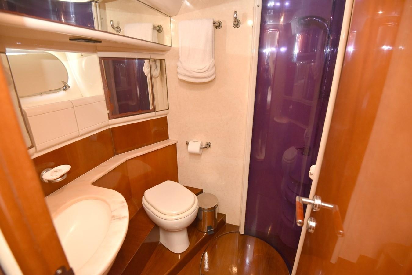 a bathroom with a toilet and a sink aboard SANTA MARIA III Yacht for Sale
