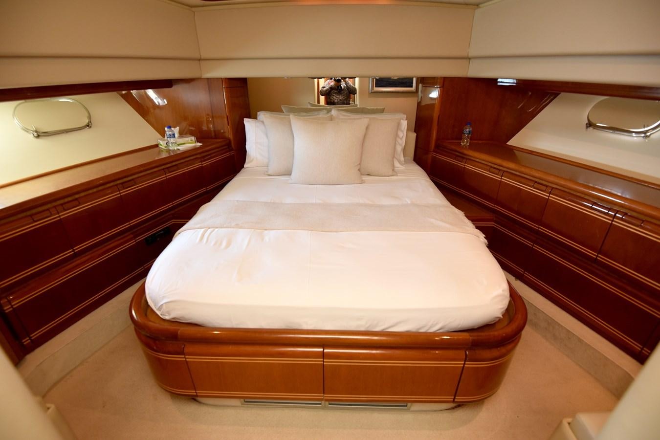 a bed with white sheets aboard SANTA MARIA III Yacht for Sale