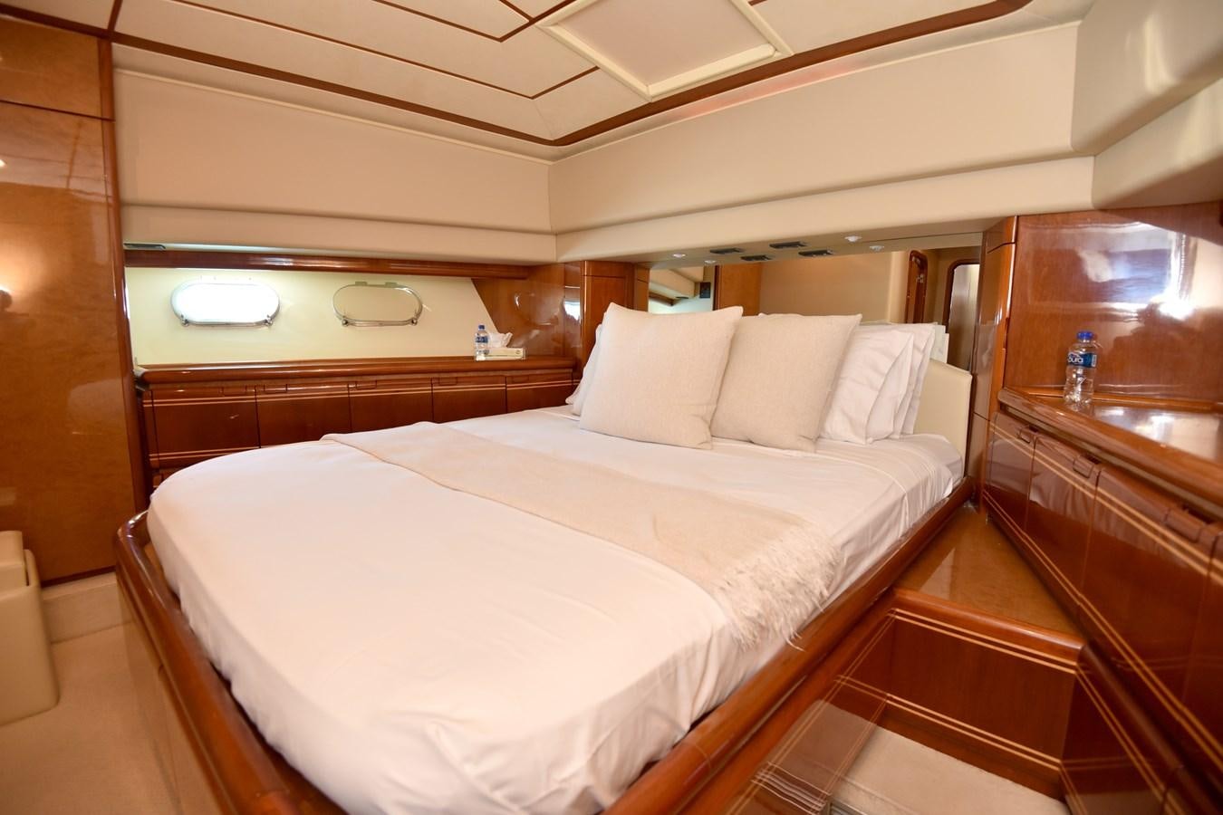 a bed with white sheets aboard SANTA MARIA III Yacht for Sale
