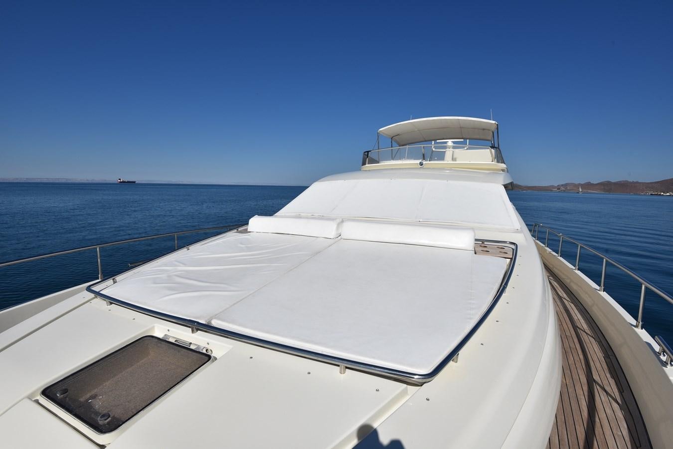 a white boat on a body of water aboard SANTA MARIA III Yacht for Sale