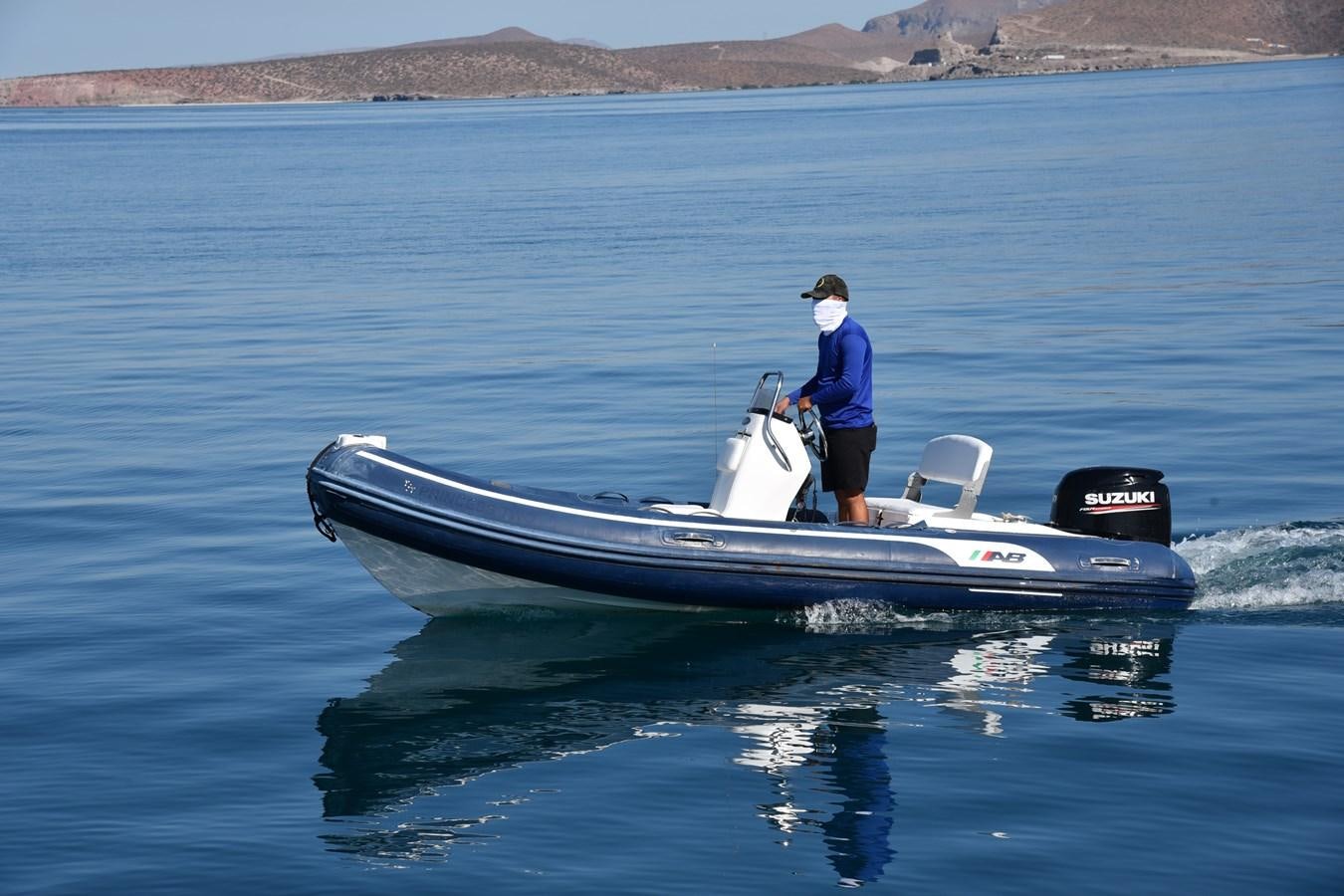 a man on a boat aboard SANTA MARIA III Yacht for Sale