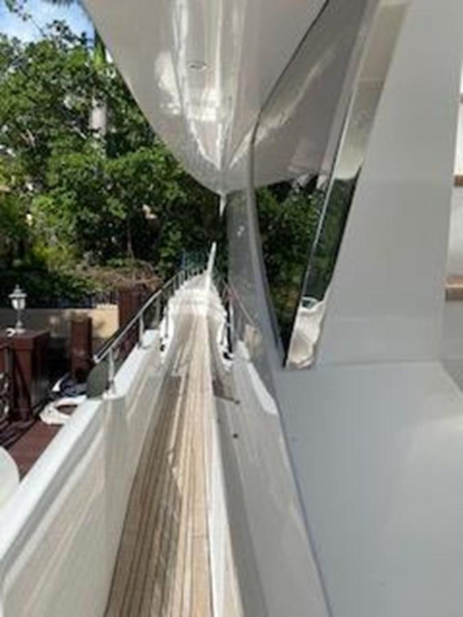 a white building with a large white awning and a white umbrella aboard FORTUNA Yacht for Sale