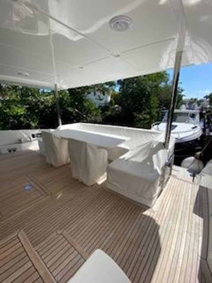 a room with a table and chairs aboard FORTUNA Yacht for Sale