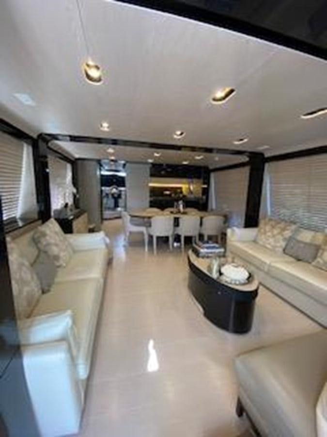 a living room with a couch and a coffee table aboard FORTUNA Yacht for Sale