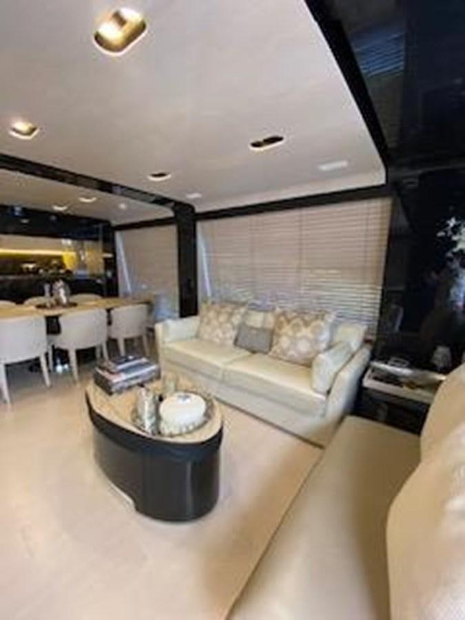 a living room with a couch and a table aboard FORTUNA Yacht for Sale