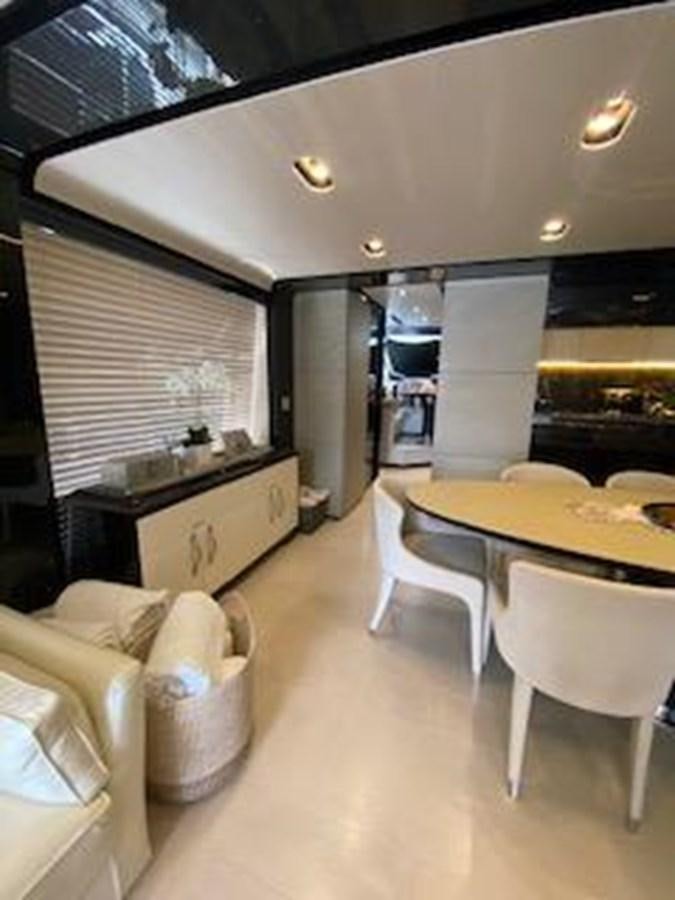 a room with a table and chairs aboard FORTUNA Yacht for Sale