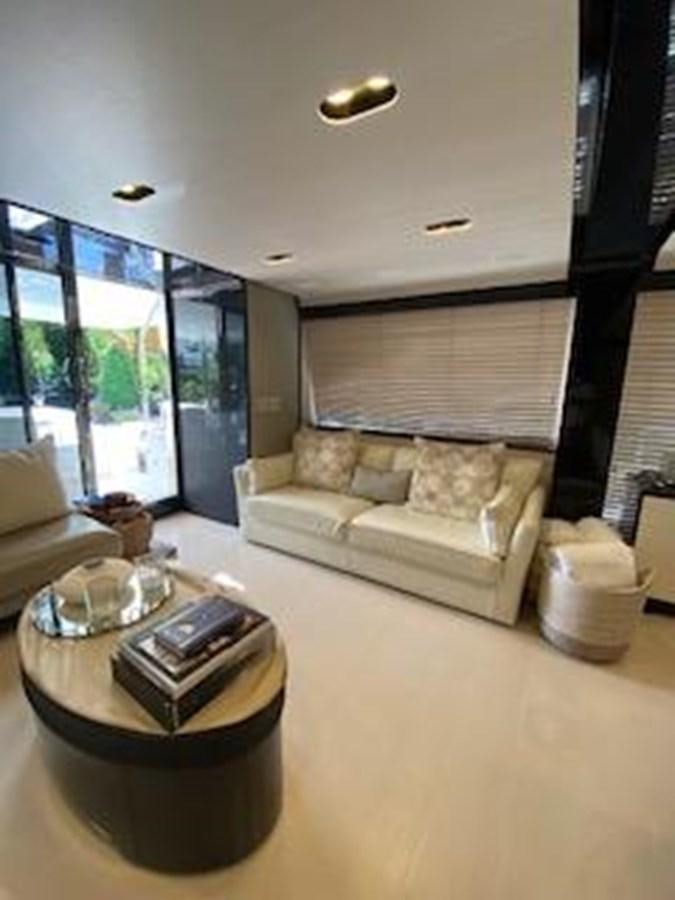 a living room with a couch and a coffee table aboard FORTUNA Yacht for Sale
