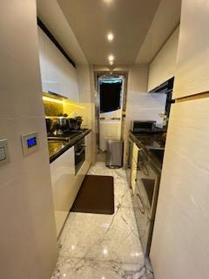 a kitchen with a tile floor aboard FORTUNA Yacht for Sale