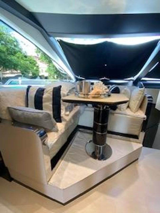 a cat sitting on a chair aboard FORTUNA Yacht for Sale