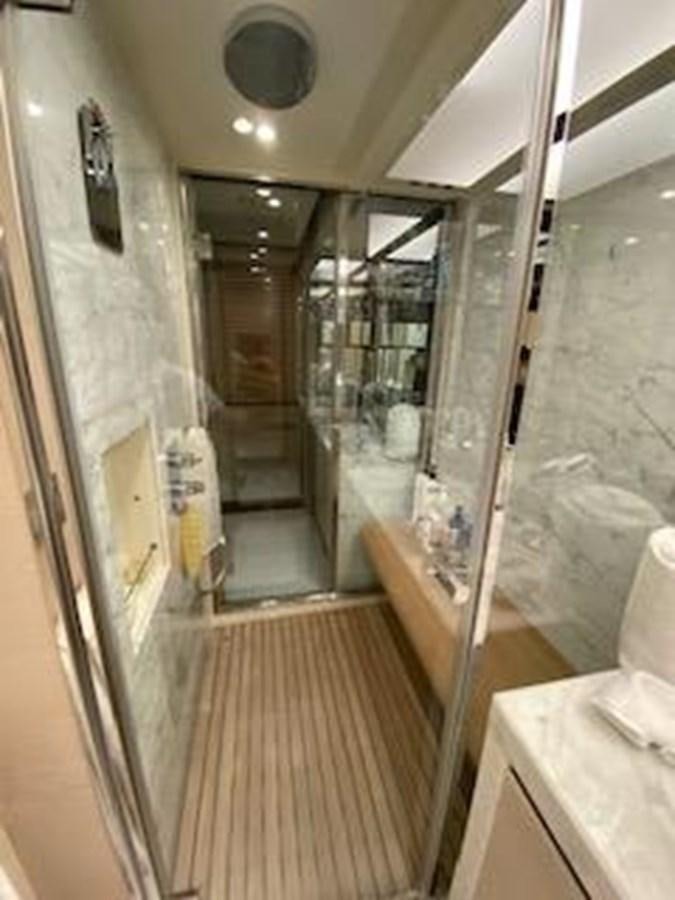 a bathroom with a glass shower aboard FORTUNA Yacht for Sale