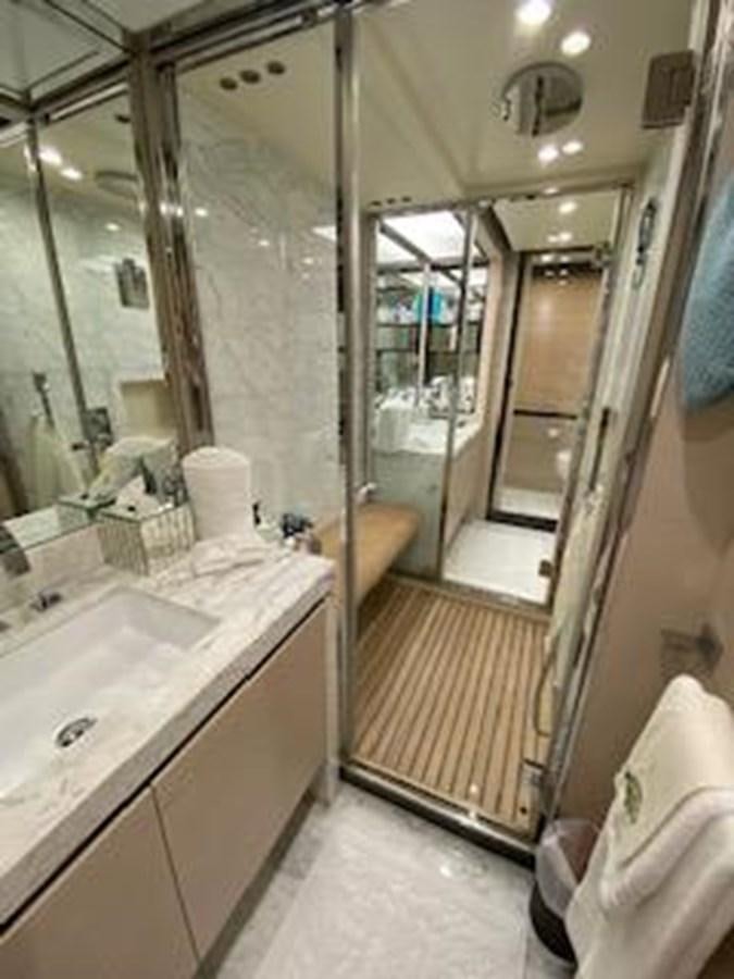 a bathroom with a large mirror aboard FORTUNA Yacht for Sale