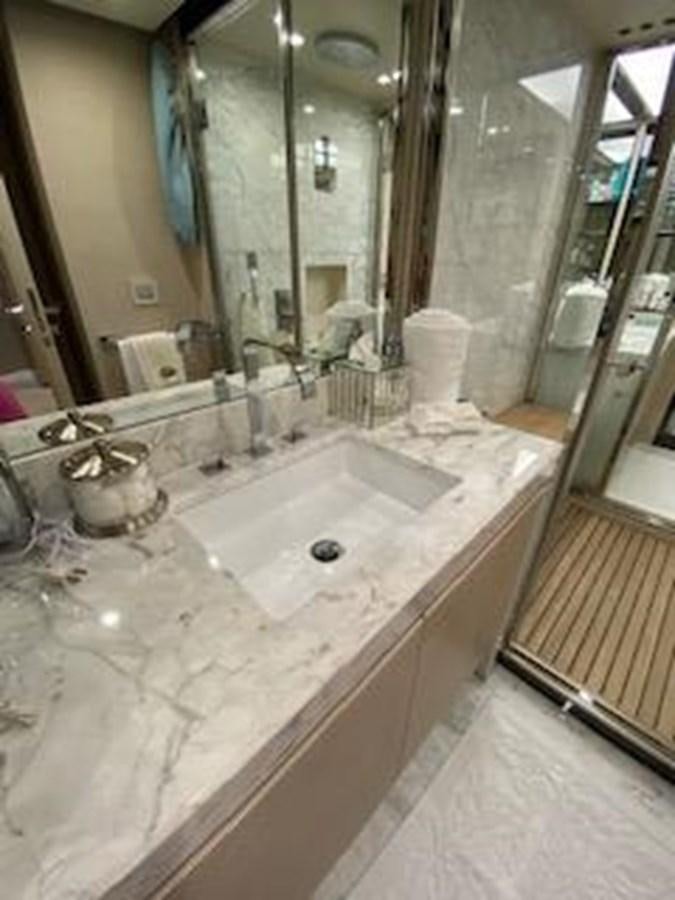 a bathroom with a large mirror aboard FORTUNA Yacht for Sale