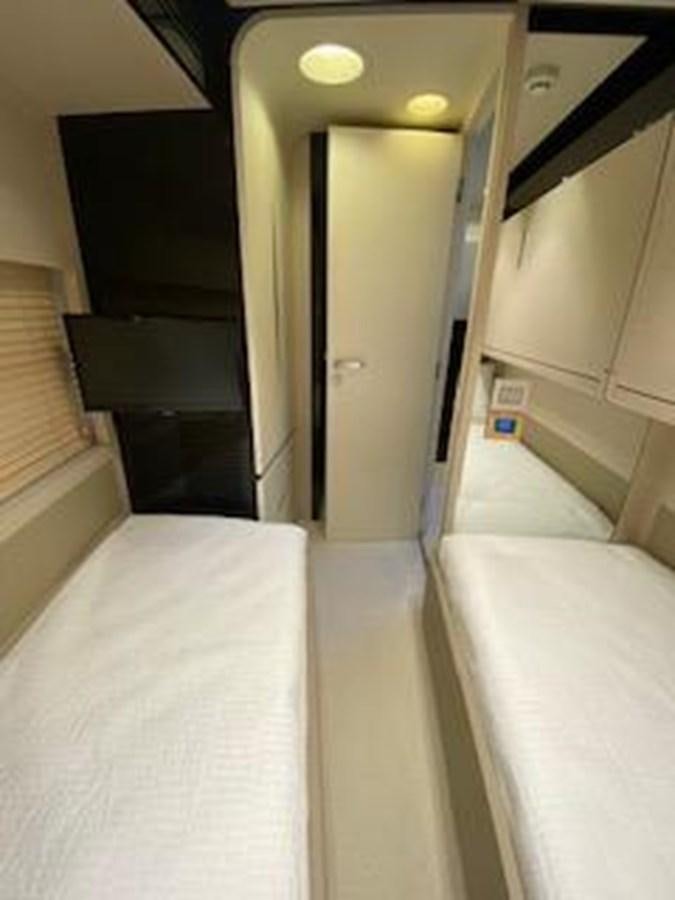 a bathroom with a bathtub and sinks aboard FORTUNA Yacht for Sale