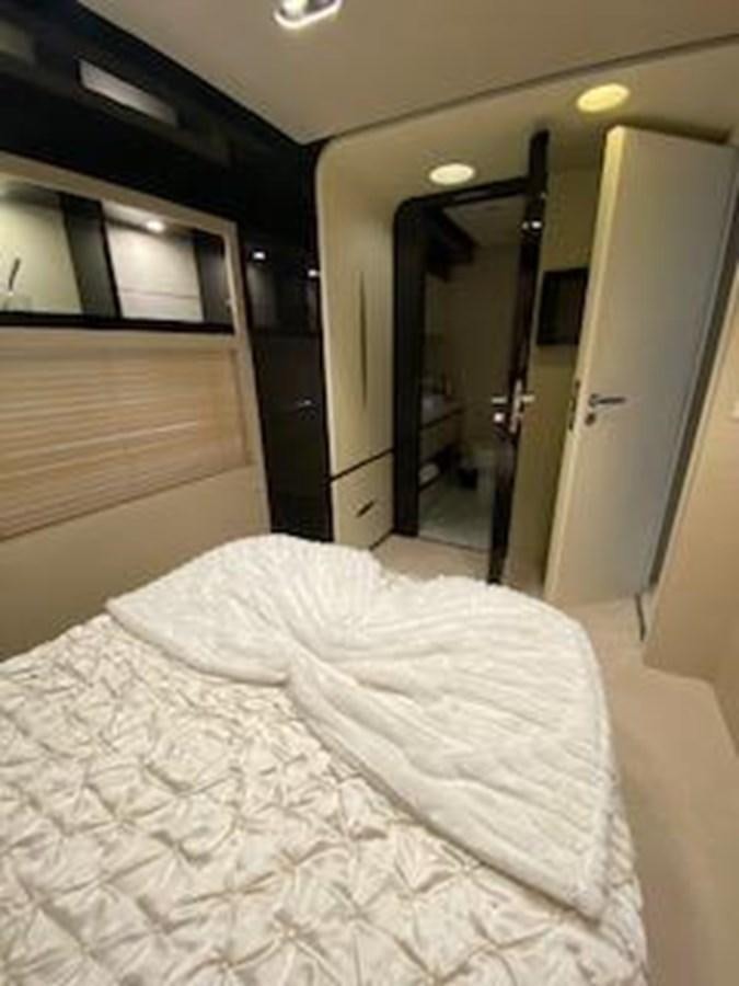 a bed in a room aboard FORTUNA Yacht for Sale