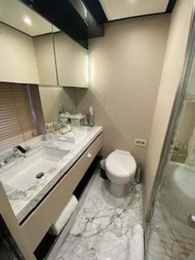 a bathroom with a sink and toilet aboard FORTUNA Yacht for Sale
