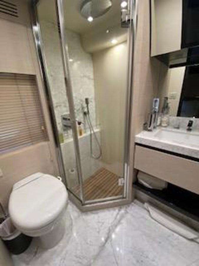 a bathroom with a glass shower aboard FORTUNA Yacht for Sale