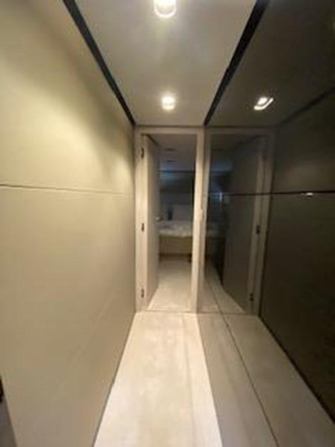 a hallway with a white door aboard FORTUNA Yacht for Sale