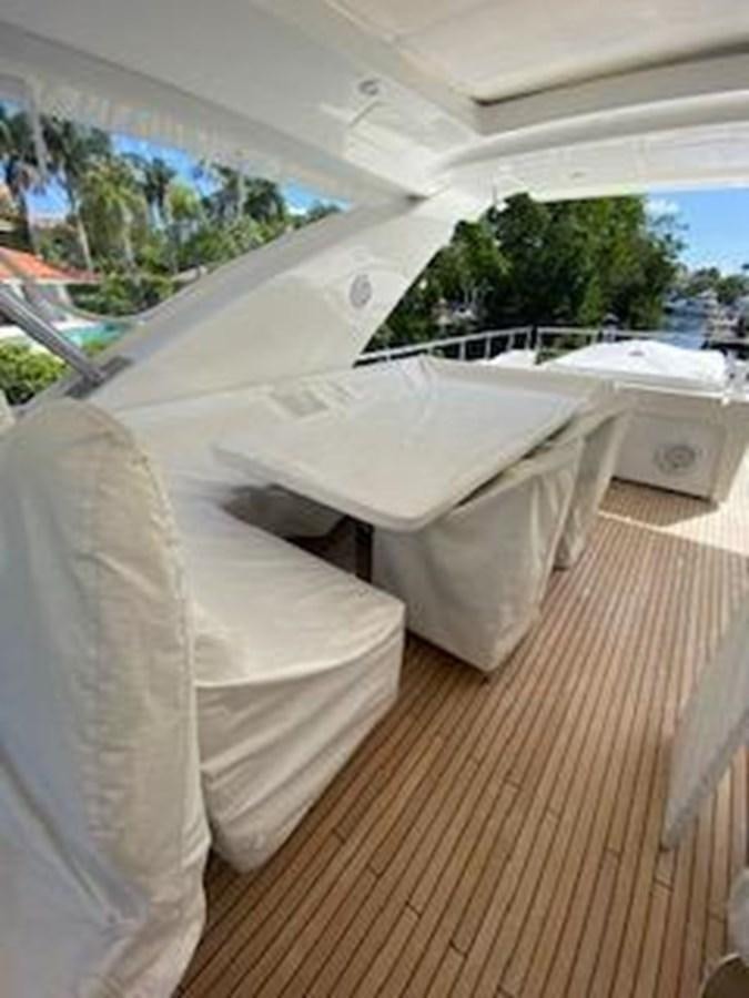 a group of white beds in a room with a large window aboard FORTUNA Yacht for Sale