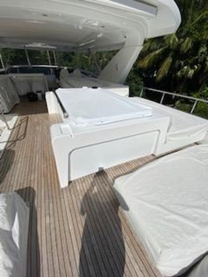 a deck with beds on it aboard FORTUNA Yacht for Sale
