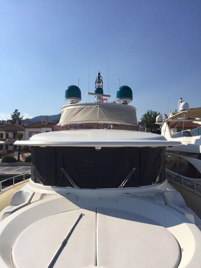 a white boat with blue domes aboard SANGRIA Yacht for Sale