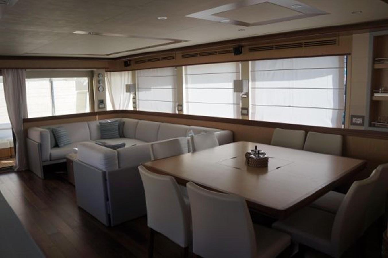 a living room with a couch and a table aboard SANGRIA Yacht for Sale