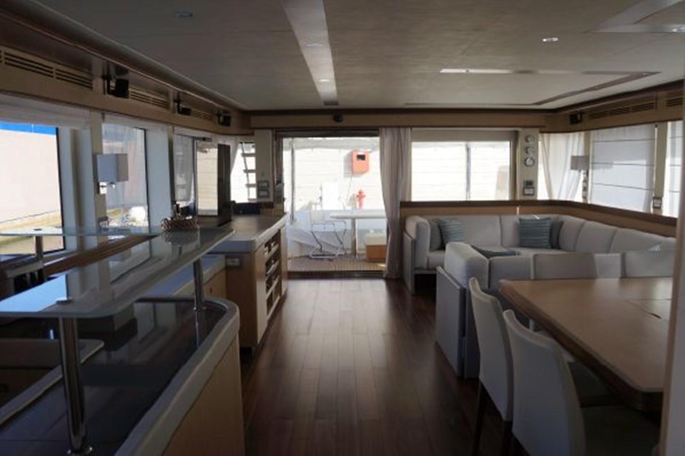 a room with a couch and a table and chairs aboard SANGRIA Yacht for Sale