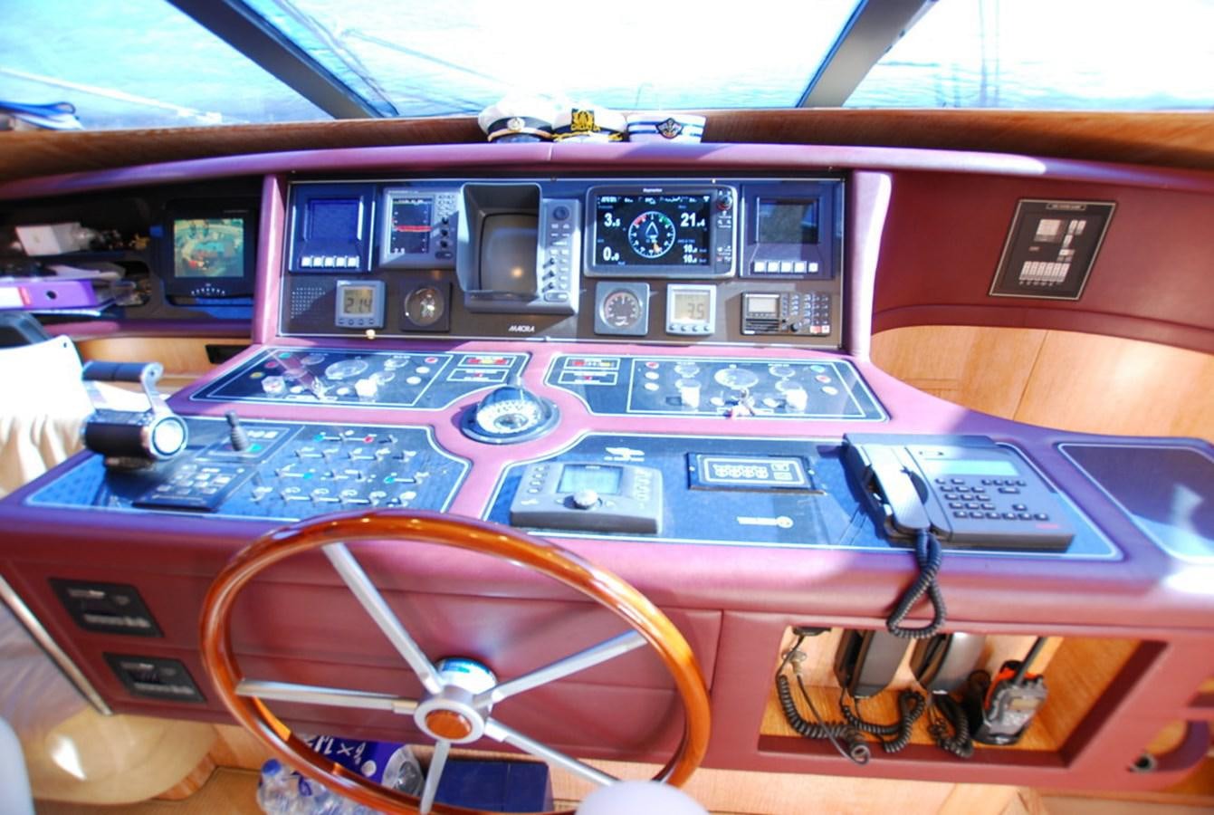 a red and purple paneled computer aboard COOKIE Yacht for Sale