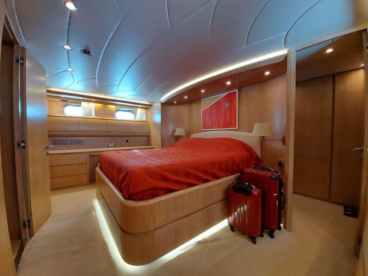 a room with a bed and a desk aboard COOKIE Yacht for Sale