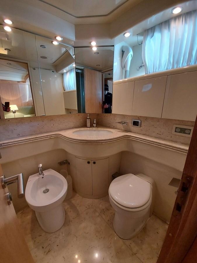 a bathroom with a sink toilet and a bidet aboard COOKIE Yacht for Sale