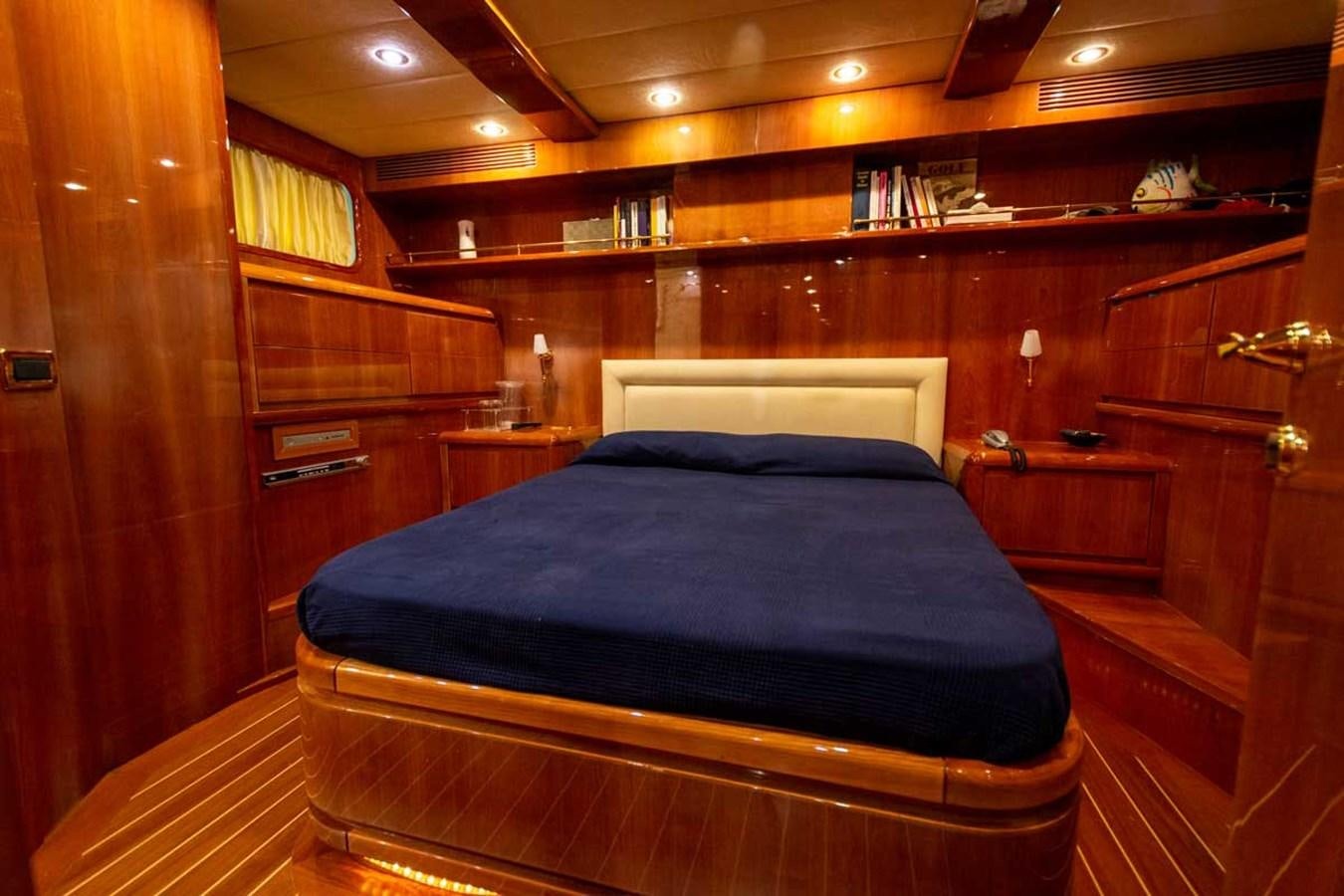 a bed in a wooden room aboard ARISTON FIVE Yacht for Sale
