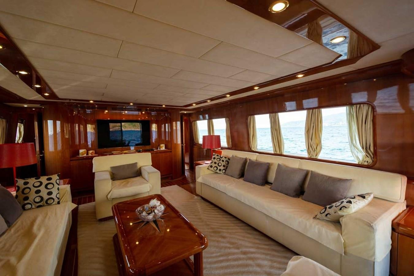 a living room with a couch and a table aboard ARISTON FIVE Yacht for Sale