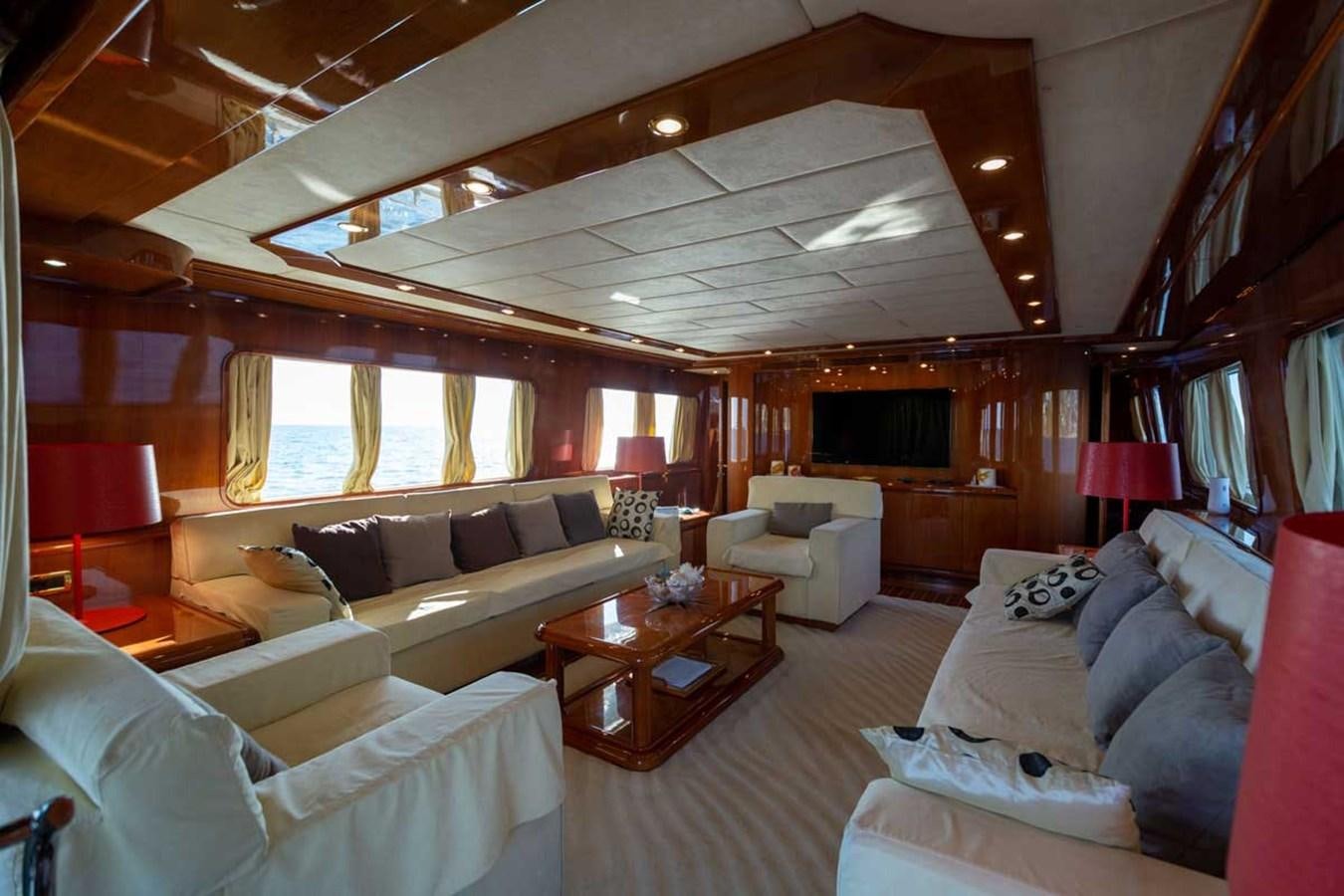 a living room with a couch and a table aboard ARISTON FIVE Yacht for Sale