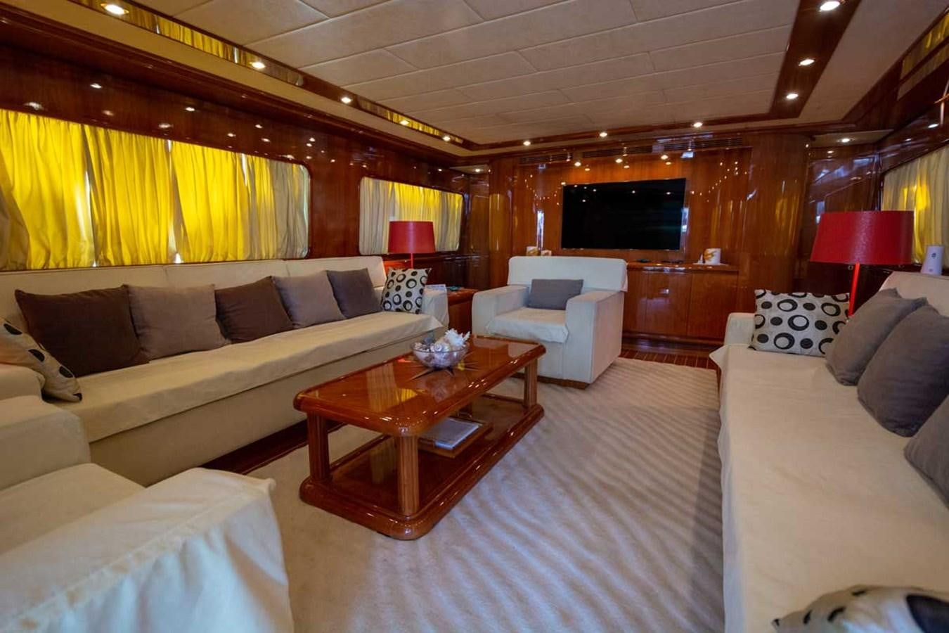 a living room with a couch and a coffee table aboard ARISTON FIVE Yacht for Sale