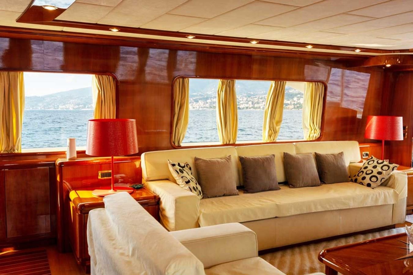 a living room with a couch and a table aboard ARISTON FIVE Yacht for Sale